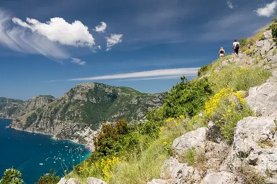 Backpacker with nordic walking at Path of Gods, Amalfi coast, Italy